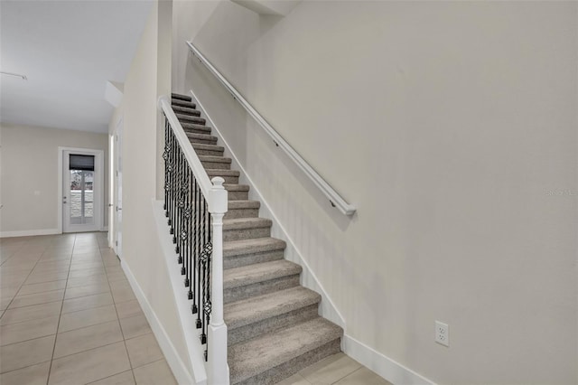 stairs with tile patterned floors