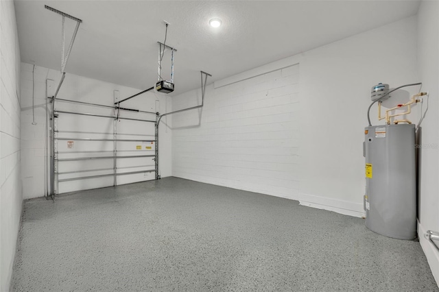 garage with electric water heater and a garage door opener