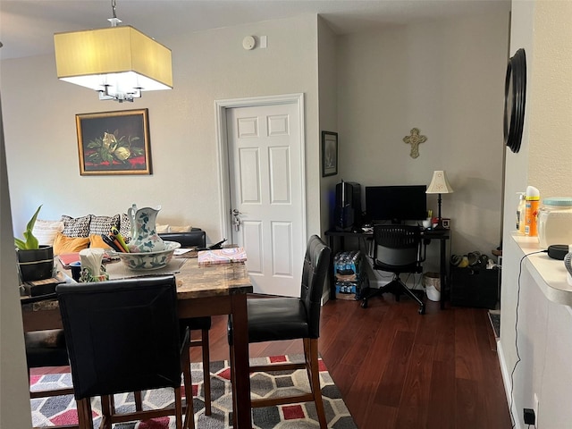 dining space featuring dark hardwood / wood-style flooring