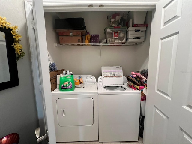 laundry room with washing machine and clothes dryer