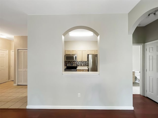 13536 Turtle Marsh Loop Unit 538, Orlando, FL 32837 - corridor with baseboards and light tile patterned flooring