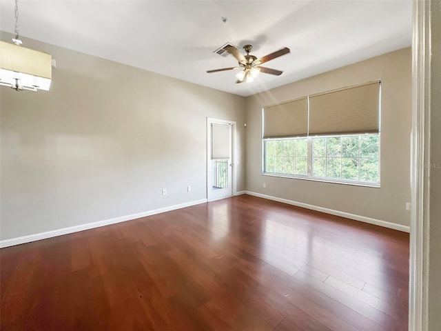 13536 Turtle Marsh Loop Unit 538, Orlando, FL 32837 - spare room with dark wood-style floors, a ceiling fan, and baseboards