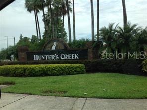 13536 Turtle Marsh Loop Unit 538, Orlando, FL 32837 - community / neighborhood sign featuring a yard