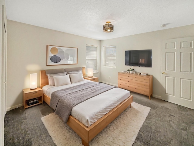 carpeted bedroom with a textured ceiling