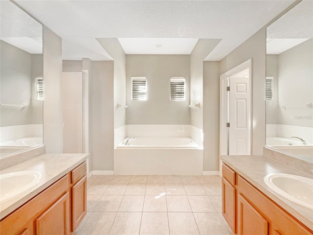 bathroom featuring tile patterned floors, vanity, and shower with separate bathtub