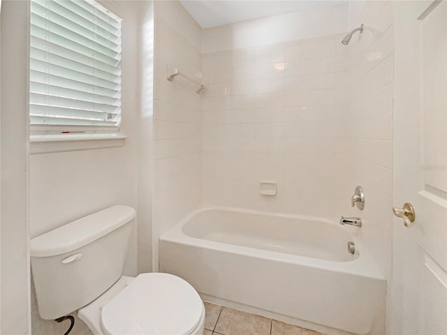 bathroom with tile patterned flooring, toilet, and tub / shower combination