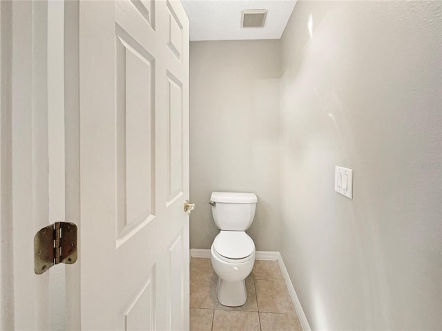 bathroom featuring tile patterned floors and toilet