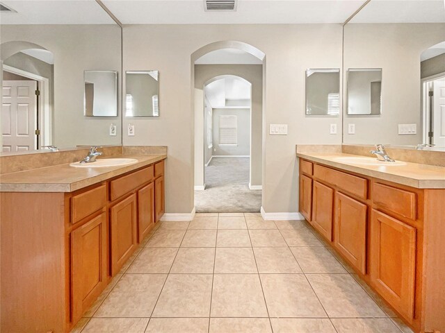 bathroom with vanity and tile patterned floors