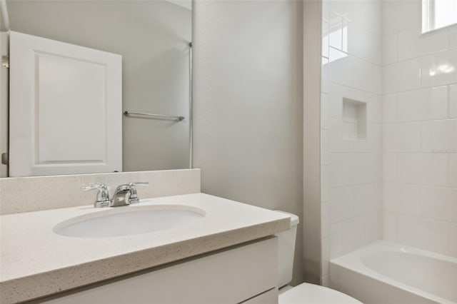 full bathroom with vanity, bathing tub / shower combination, and toilet