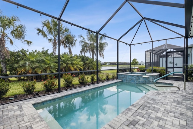 view of swimming pool featuring an in ground hot tub, a patio, and glass enclosure