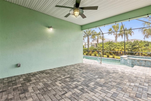 interior space featuring a lanai, ceiling fan, a swimming pool with hot tub, and a mountain view