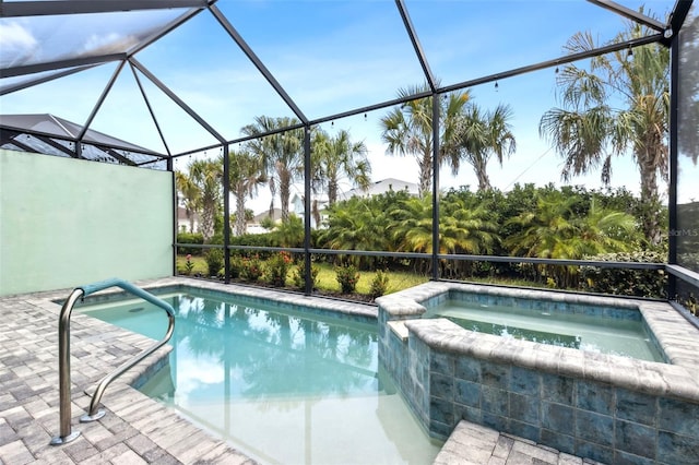 view of swimming pool featuring a lanai and an in ground hot tub