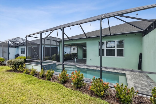 back of property featuring a yard and a lanai