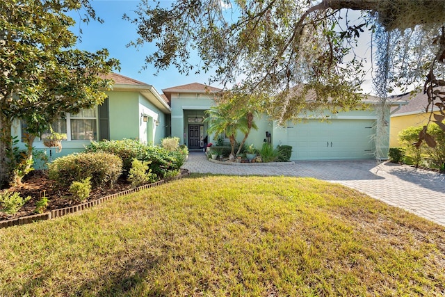 view of front facade with a front yard and a garage