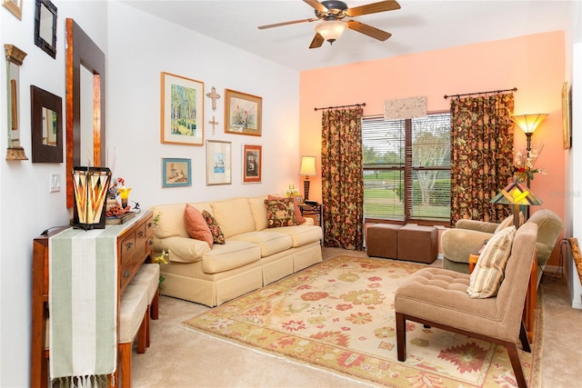 carpeted living room featuring ceiling fan