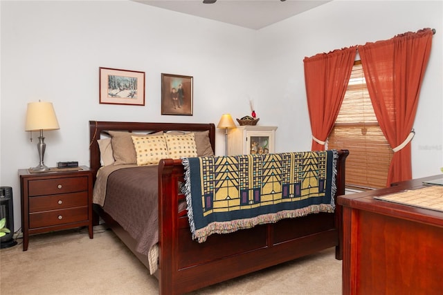 bedroom featuring light carpet