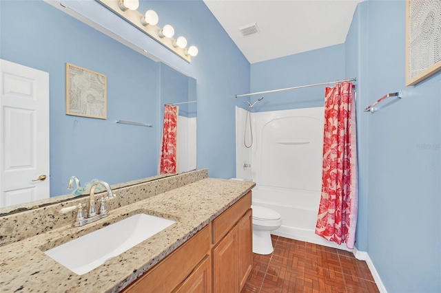 full bathroom featuring vanity, shower / tub combo, and toilet