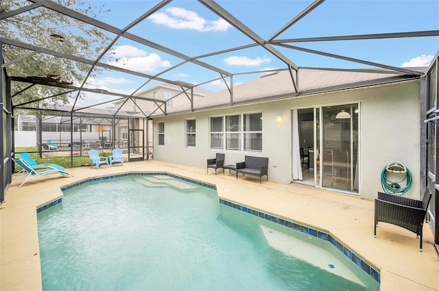 view of swimming pool featuring a lanai and a patio area