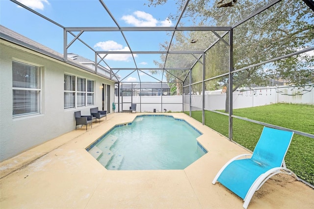 view of pool with a patio, a lanai, and a lawn