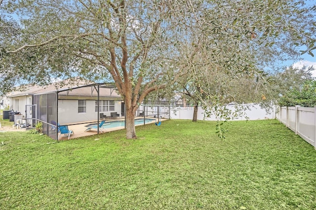 view of yard with a fenced in pool