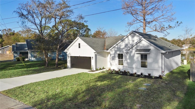 modern inspired farmhouse with a front yard and a garage