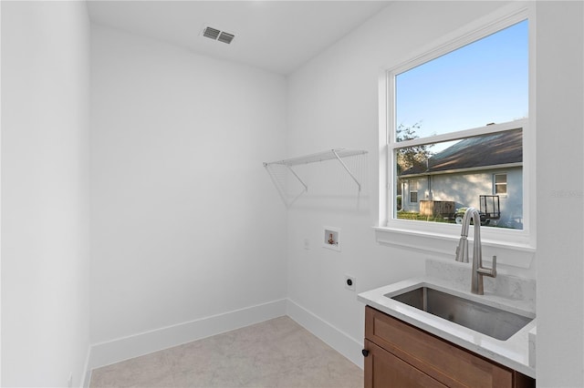 laundry room featuring hookup for an electric dryer, a healthy amount of sunlight, sink, and hookup for a washing machine