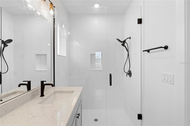 bathroom with vanity and walk in shower