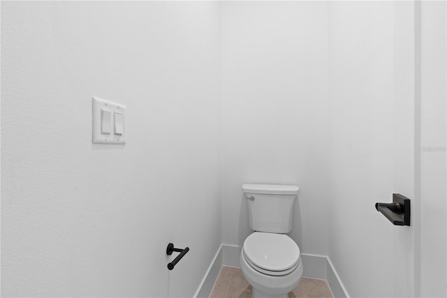 bathroom with tile patterned floors and toilet