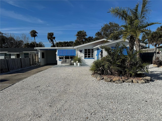 view of front of property with a carport