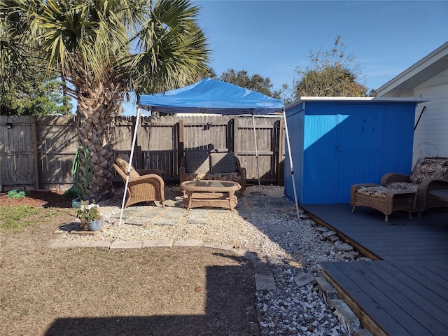 view of yard with a shed and a deck