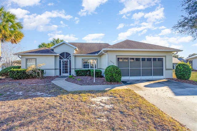 ranch-style house featuring a garage