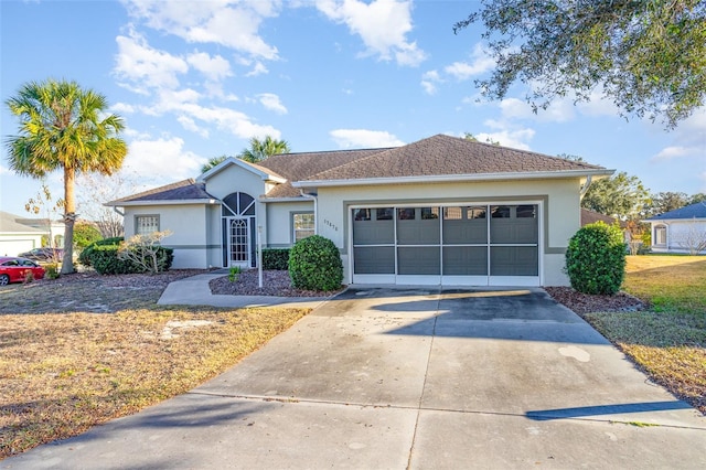 ranch-style house featuring a garage