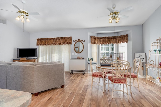 living room with light hardwood / wood-style floors and ceiling fan