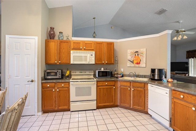 kitchen featuring lofted ceiling, ceiling fan, sink, white appliances, and light tile patterned floors