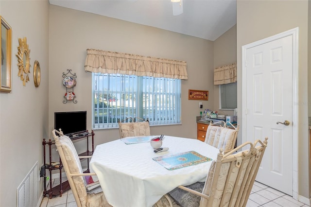 dining room with ceiling fan and light tile patterned floors