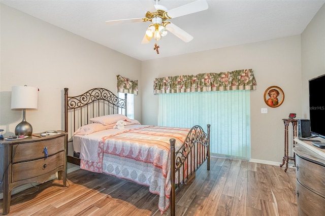 bedroom featuring ceiling fan and wood-type flooring