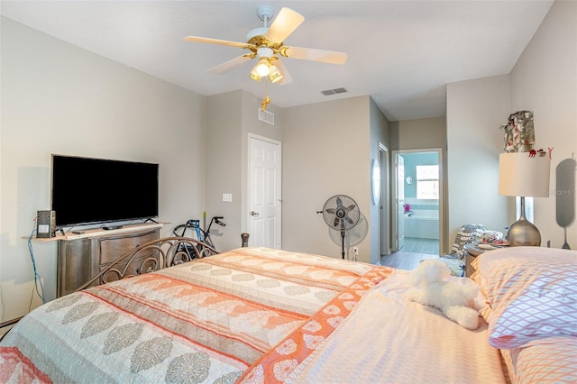 bedroom with ceiling fan and connected bathroom