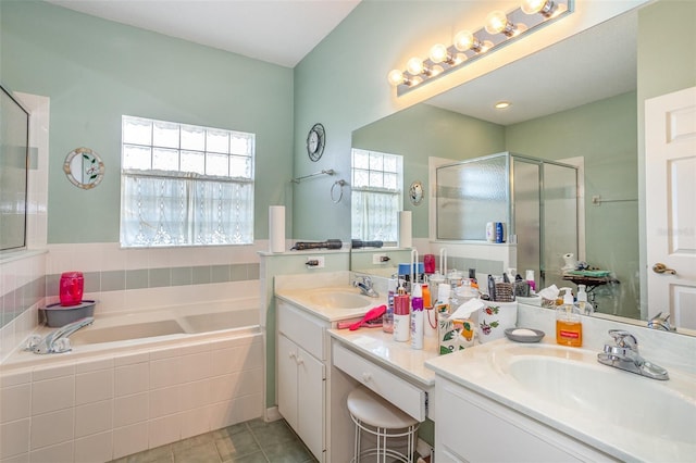 bathroom with vanity, independent shower and bath, and tile patterned flooring