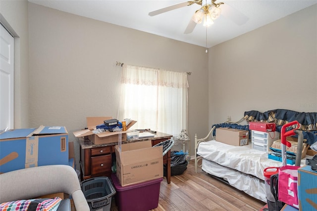 bedroom featuring light wood-type flooring and ceiling fan