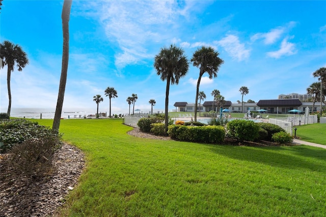 3663 S Atlantic Ave Unit 11D, New Smyrna Beach, FL 32169 - view of property's community featuring a water view and a yard