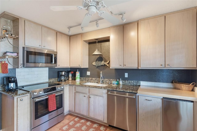 3663 S Atlantic Ave Unit 11D, New Smyrna Beach, FL 32169 - kitchen with sink, rail lighting, stainless steel appliances, and light brown cabinets
