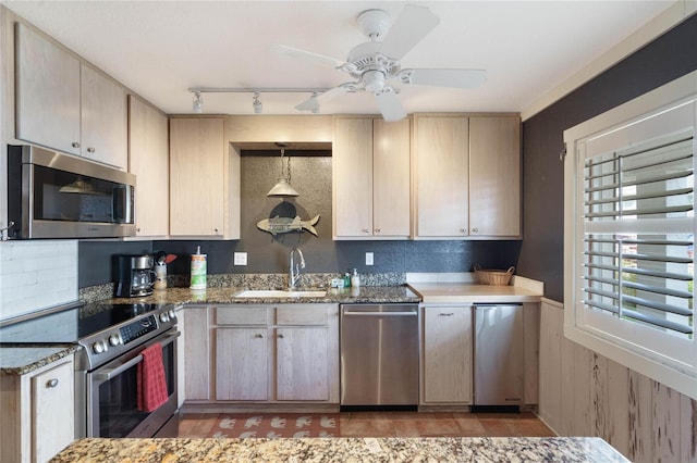 3663 S Atlantic Ave Unit 11D, New Smyrna Beach, FL 32169 - kitchen with light brown cabinetry, ceiling fan, sink, and appliances with stainless steel finishes