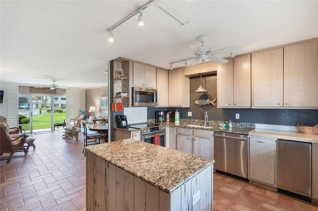 3663 S Atlantic Ave Unit 11D, New Smyrna Beach, FL 32169 - kitchen featuring appliances with stainless steel finishes, backsplash, light brown cabinetry, light stone counters, and sink