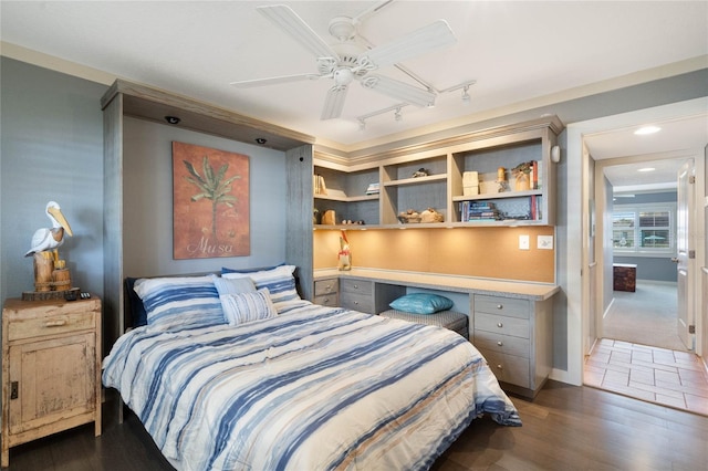 3663 S Atlantic Ave Unit 11D, New Smyrna Beach, FL 32169 - bedroom featuring dark hardwood / wood-style floors, track lighting, and ceiling fan
