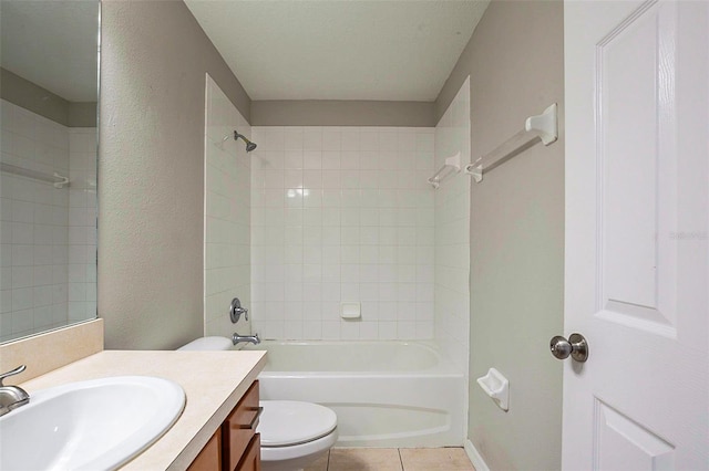 full bathroom featuring toilet, tiled shower / bath, tile patterned floors, and vanity