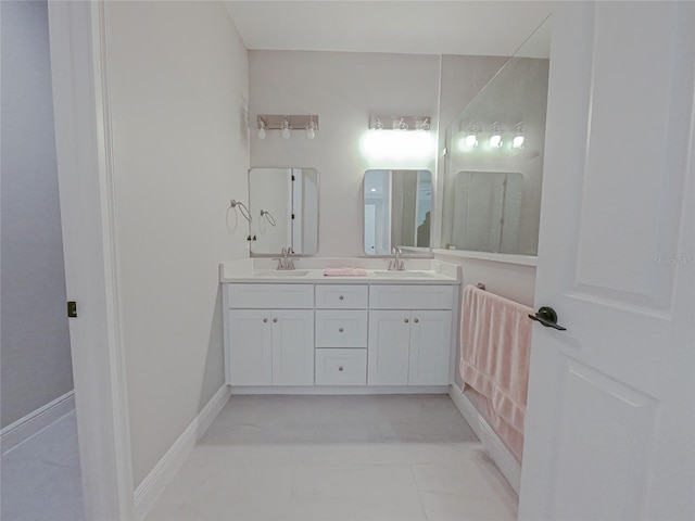 bathroom featuring tile patterned flooring and vanity