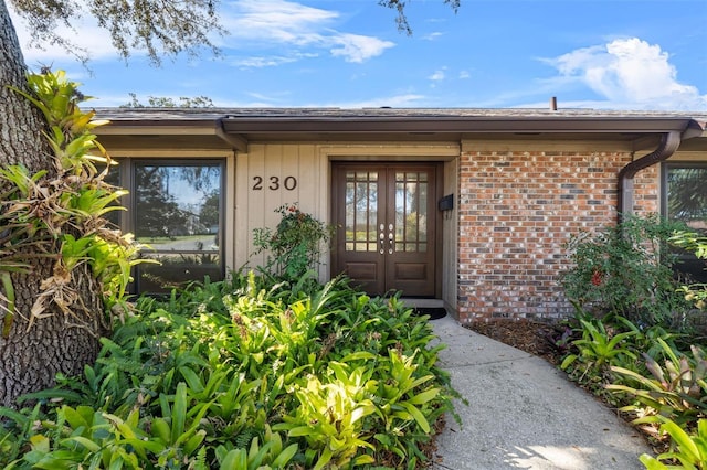 property entrance featuring french doors