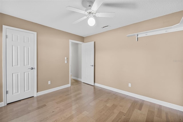 unfurnished bedroom featuring ceiling fan and light hardwood / wood-style flooring