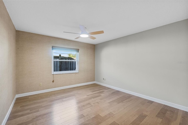 unfurnished room featuring light hardwood / wood-style flooring and ceiling fan