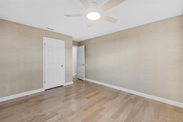 unfurnished bedroom featuring light hardwood / wood-style flooring and ceiling fan